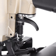 Close-up of the part of meite USA CN45R Pneumatic Coil Roofing Nailer loading in white background, adjusting to single-firing or continuous-fire