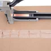 Meite USA HB3515 manual boxing stapler in use on a cardboard box