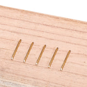 Meite USA 16 gauge 1" upholstery staples driven into the wooden board