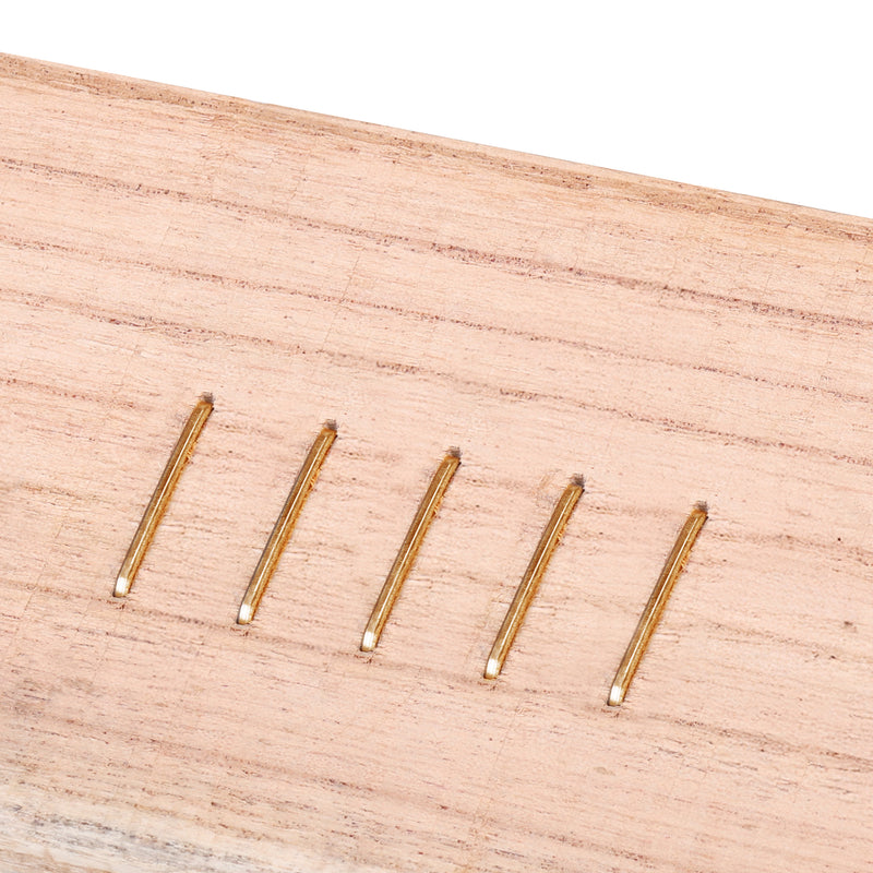 Meite USA 16 gauge 1" upholstery staples driven into the wooden board