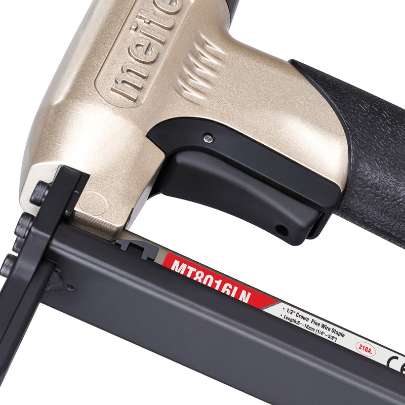 Close-up of the trigger section of the meite USA MT8016LN 21Ga 1/2'' crown pneumatic upholstery stapler.