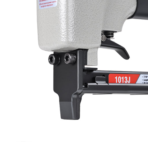 Close-up view of meite USA 1013J 20 gauge pneumatic upholstery stapler showing metal muzzle