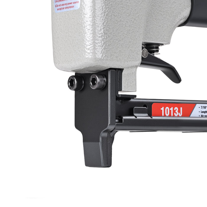 Close-up view of meite USA 1013J 20 gauge pneumatic upholstery stapler showing metal muzzle