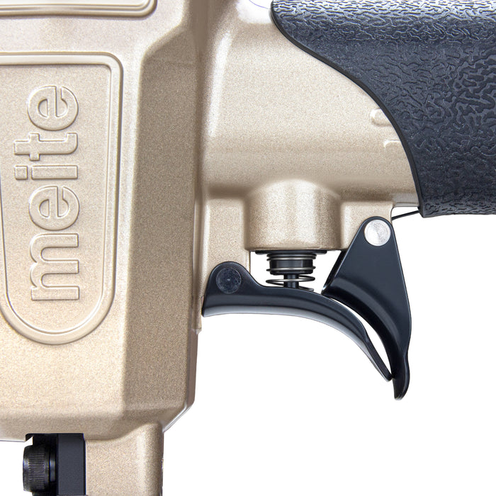 Close-up of the Meite USA 425KC 18Ga  pneumatic upholstery stapler showing sensitive trigger and meite logo on the stapler.