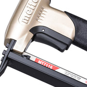 Close-up of the trigger section of the meite USA MT7116 22Ga pneumatic upholstery stapler.