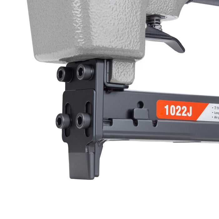 Detailed view of meite USA 1022J 20 gauge pneumatic upholstery stapler showing metal muzzle and trigger for fine stapling work.
