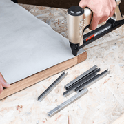 meite USA 22Ga 3/8" Crown 304 stainless steel upholstery staples fastening the canvas with stapler