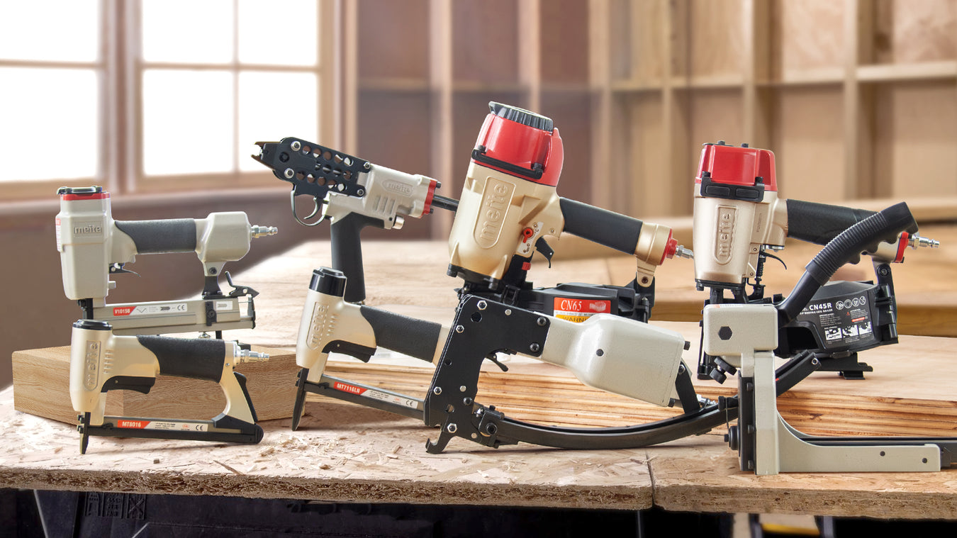 Meite USA pneumatic nail gun series on wood workshop background 